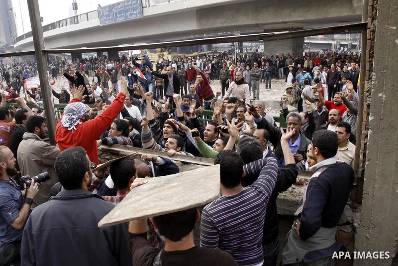 Anti-government protestors take part in a protest in Cairo's main square, Egypt, Thursday, Feb. 3, 2011. New clashes are heating up again and shots are being fired in the air around Cairo's central Tahrir Square as anti-...