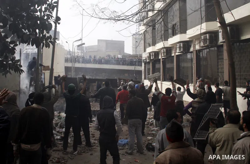 Egyptian pro government protesters throw stones at anti government protesters in downtown Cairo, Egypt, Thursday, Feb. 3, 2011. New clashes are heating up again and shots are being fired in the air around Cairo's central...