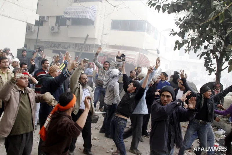 Egyptian pro government protesters throw stones at anti government protesters in downtown Cairo, Egypt, Thursday, Feb. 3, 2011. New clashes are heating up again and shots are being fired in the air around Cairo's central...