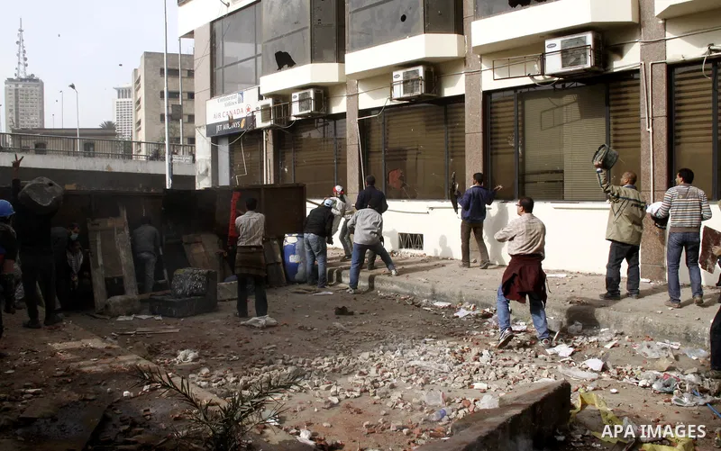 Egyptian pro government protesters throw stones at anti government protesters in downtown Cairo, Egypt, Thursday, Feb. 3, 2011. New clashes are heating up again and shots are being fired in the air around Cairo's central...