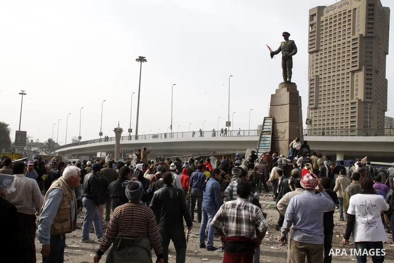 Anti-government protestors take part in a protest in Cairo's main square, Egypt, Thursday, Feb. 3, 2011. New clashes are heating up again and shots are being fired in the air around Cairo's central Tahrir Square as anti-...