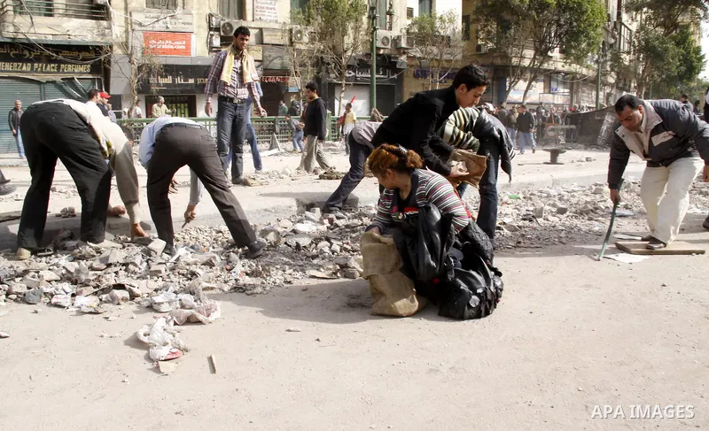 Anti-government protestors take part in a protest in Cairo's main square, Egypt, Thursday, Feb. 3, 2011. New clashes are heating up again and shots are being fired in the air around Cairo's central Tahrir Square as anti-...