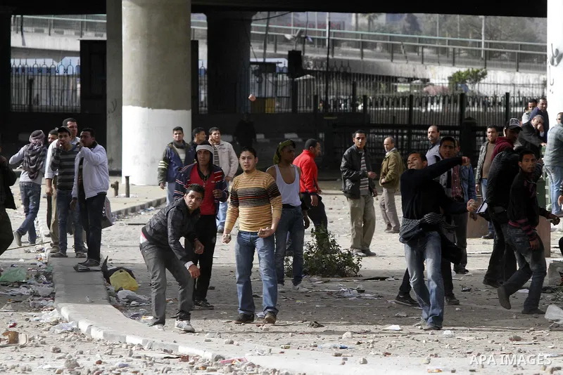 Egyptian protesters are seen in and around Tahrir square, as supporters and opponents of President Hosni Mubarak clash in some parts of the square, Cairo, capital of Egypt, Feb. 3, 2011. Egyptian army appeared to be tryi...