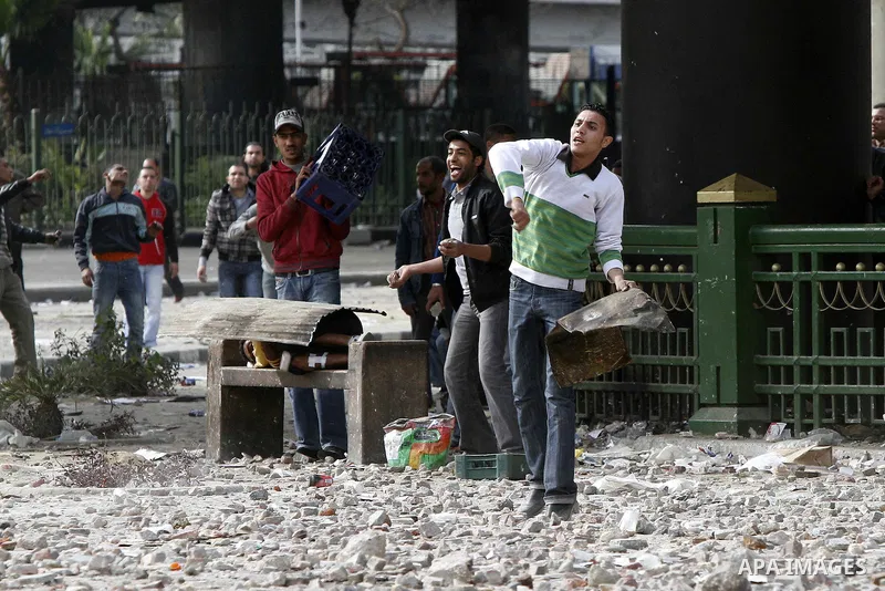Egyptian protesters are seen in and around Tahrir square, as supporters and opponents of President Hosni Mubarak clash in some parts of the square, Cairo, capital of Egypt, Feb. 3, 2011. Egyptian army appeared to be tryi...