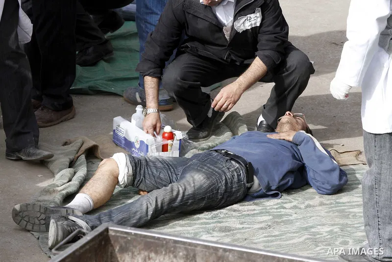 Egyptian protesters are seen in and around Tahrir square, as supporters and opponents of President Hosni Mubarak clash in some parts of the square, Cairo, capital of Egypt, Feb. 3, 2011. Egyptian army appeared to be tryi...