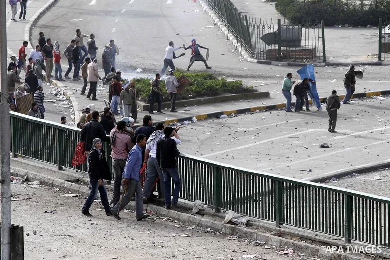 Egyptian protesters are seen in and around Tahrir square, as supporters and opponents of President Hosni Mubarak clash in some parts of the square, Cairo, capital of Egypt, Feb. 3, 2011. Egyptian army appeared to be tryi...