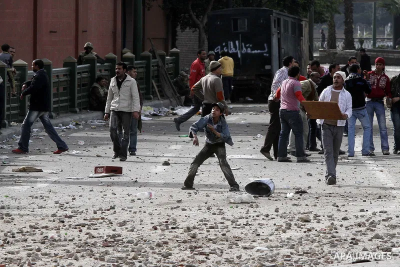 Egyptian protesters are seen in and around Tahrir square, as supporters and opponents of President Hosni Mubarak clash in some parts of the square, Cairo, capital of Egypt, Feb. 3, 2011. Egyptian army appeared to be tryi...