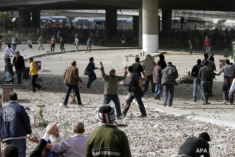Egyptian protesters are seen in and around Tahrir square, as supporters and opponents of President Hosni Mubarak clash in some parts of the square, Cairo, capital of Egypt, Feb. 3, 2011. Egyptian army appeared to be tryi...