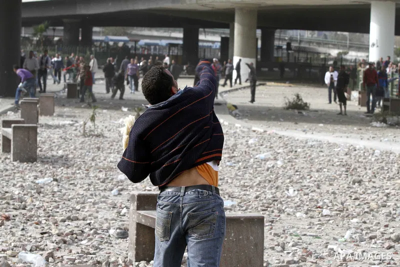 Egyptian protesters are seen in and around Tahrir square, as supporters and opponents of President Hosni Mubarak clash in some parts of the square, Cairo, capital of Egypt, Feb. 3, 2011. Egyptian army appeared to be tryi...