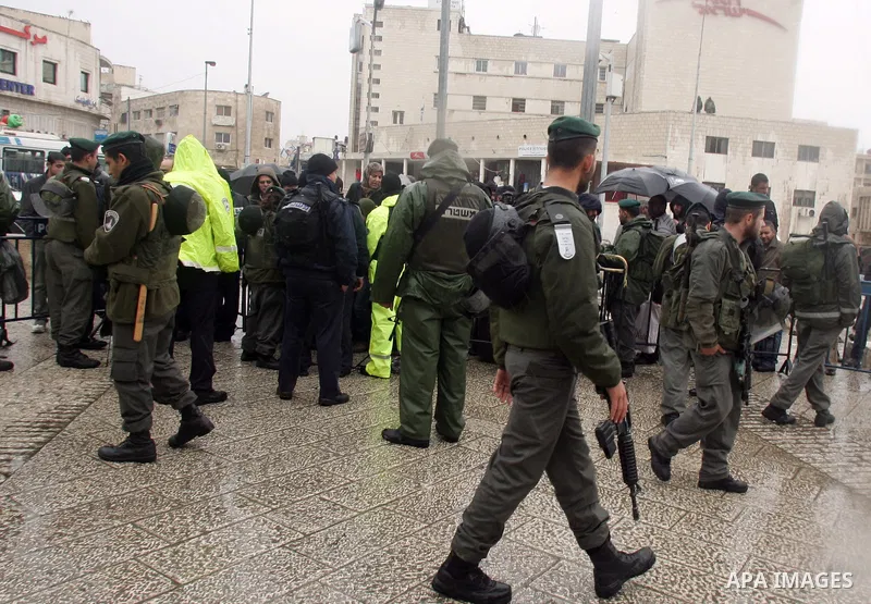 Israeli soldiers check Palestinian worrshippers aim to attend Friday prayers outside the Al Aqsa Mosque compound, also known to Jews as the Temple Mount, in Jerusalem's old city in the old city of Jerusalem on Feb. 4,201...