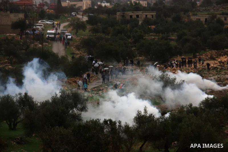 Israeli sildiers fire tear gas canisters towards Palestinian protesters during a protest in the village of Bilin near Ramallah on Feb. 4, 2011. Photo by Wagdi Eshtayah