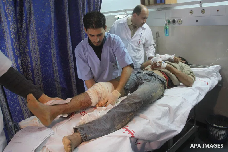 A wounded Palestinian man receives treatment at Al-Shifa hospital in Gaza City, Feb. 5, 2011. A three Palestinian were wounded Saturday when Israeli troops opened fire on Palestinian workers who collect stones in eastern...