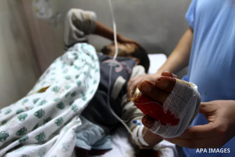 A Palestinian youth receives treatment at a hospital after he injured by Israeli fire near the fence in the east of Gaza city on Feb. 5,2011. Photo by Ashraf Amra
