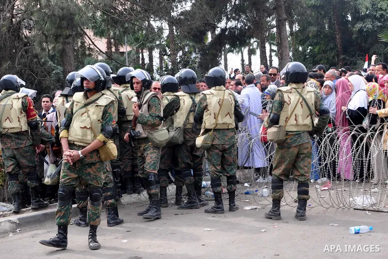 Egyptian army soldiers encircle anti-government protesters to prevent clashes with Mubarak supporters in Tahrir square in Cairo, Egypt, Saturday, Feb. 5, 2011. President Barack Obama said Egypt's Hosni Mubarak should do...