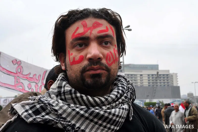 Egyptian anti-Mubarak protesters take part in a protest in Cairo, Egypt, Saturday, Feb. 5, 2011. President Barack Obama said Egypt's Hosni Mubarak should do the statesmanlike thing and make a quick handoff to a more repr...
