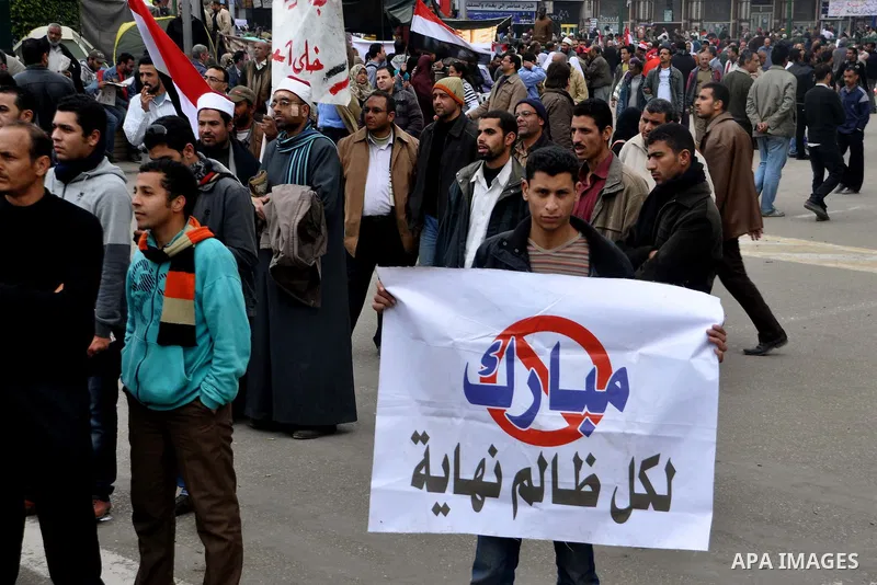 Egyptian anti-Mubarak protesters take part in a protest in Cairo, Egypt, Saturday, Feb. 5, 2011. President Barack Obama said Egypt's Hosni Mubarak should do the statesmanlike thing and make a quick handoff to a more repr...