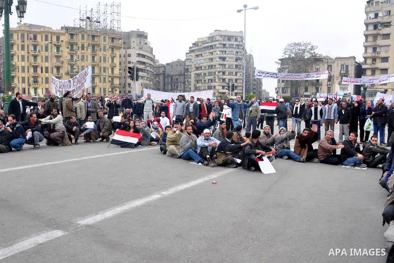 Egyptian anti-Mubarak protesters take part in a protest in Cairo, Egypt, Saturday, Feb. 5, 2011. President Barack Obama said Egypt's Hosni Mubarak should do the statesmanlike thing and make a quick handoff to a more repr...