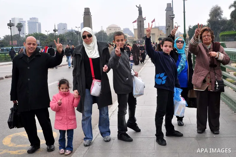 Egyptian anti-Mubarak protesters take part in a protest in Cairo, Egypt, Saturday, Feb. 5, 2011. President Barack Obama said Egypt's Hosni Mubarak should do the statesmanlike thing and make a quick handoff to a more repr...