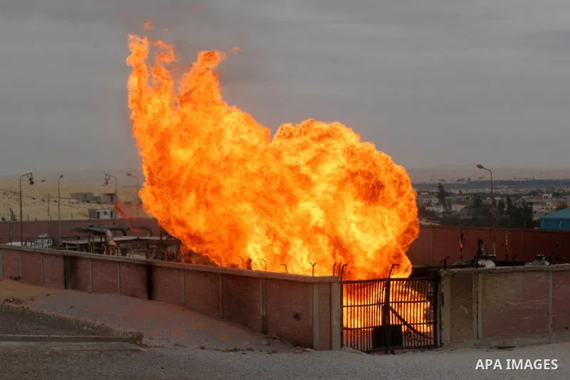 Flames are seen after an explosion went off at a gas terminal in Egypt's northern Sinai Peninsula on Saturday, Feb. 5, 2011 in El-Arish, setting off a massive fire. No injuries were reported, and the blaze was quickly br...
