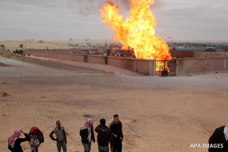 Flames are seen after an explosion went off at a gas terminal in Egypt's northern Sinai Peninsula on Saturday, Feb. 5, 2011 in El-Arish, setting off a massive fire. No injuries were reported, and the blaze was quickly br...