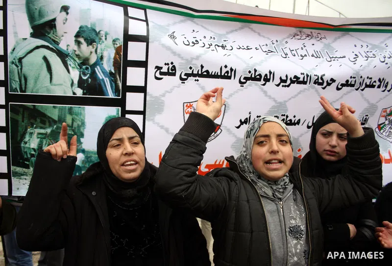 Palestinians protestors take part in a demonstration against the Israeli controversial separation barrier in the West Bank village of Beit Omar, near Hebron, 05 February 2011. Israel says the network of steel and concret...