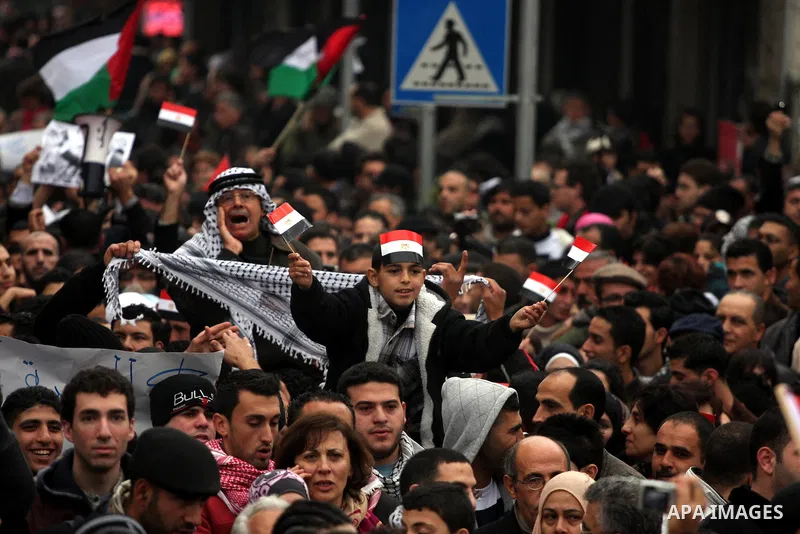 Palestinians demonstrate during a rally to show solidarity with anti-Mubarak protestors in Egypt, during a demonstration in the West Bank city of Ramallah, Saturday, Feb. 5, 2011. Photo by Issam Rimawi