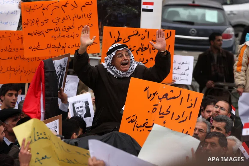 Palestinians demonstrate during a rally to show solidarity with anti-Mubarak protestors in Egypt, during a demonstration in the West Bank city of Ramallah, Saturday, Feb. 5, 2011. Photo by Issam Rimawi