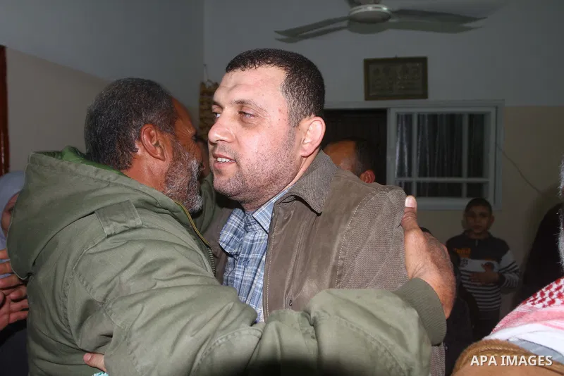 Ayman Nofal , a top Hamas armed commander, is greeted by Hamas supporters and his relatives upon his arrival to his home in Nusairat in the Central Gaza strip February 5, 2011. A senior Hamas commander returned to the Ga...