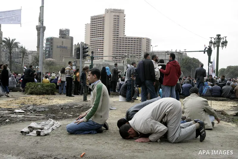 Opposition supporters pray in Tahrir Square in Cairo February 6, 2011. Demonstrators camped out in Cairo's Tahrir Square, which has become an epicentre for protest, vowed to intensify their battle to oust Egypt's Preside...