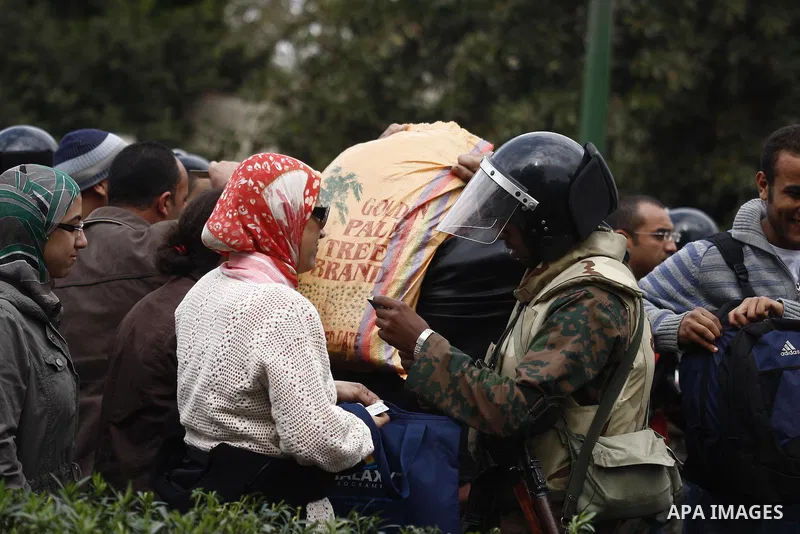 Egyptian soldiers stand guards at Tahrir Square in Cairo Feb. 6, 2011. Demonstrators camped out in Cairo's Tahrir Square, which has become an epicentre for protest, vowed to intensify their battle to oust Egypt's Preside...