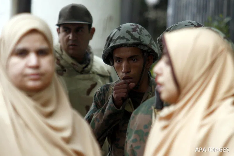 Egyptian soldiers stand guards at Tahrir Square in Cairo Feb. 6, 2011. Demonstrators camped out in Cairo's Tahrir Square, which has become an epicentre for protest, vowed to intensify their battle to oust Egypt's Preside...