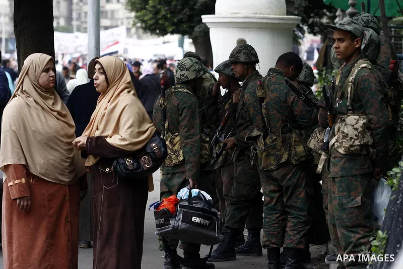 Egyptian soldiers stand guards at Tahrir Square in Cairo Feb. 6, 2011. Demonstrators camped out in Cairo's Tahrir Square, which has become an epicentre for protest, vowed to intensify their battle to oust Egypt's Preside...