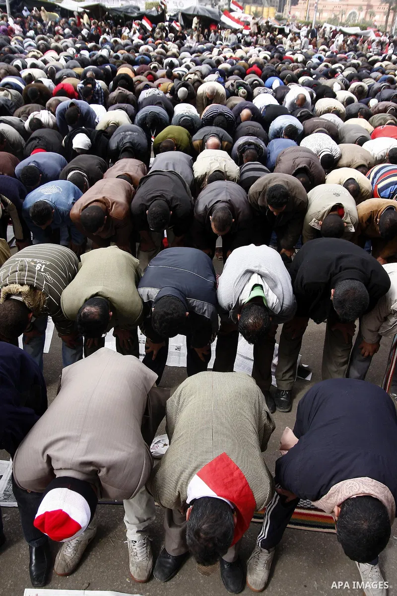Opposition supporters prayin Tahrir Square in Cairo February 6, 2011. Demonstrators camped out in Cairo's Tahrir Square, which has become an epicentre for protest, vowed to intensify their battle to oust Egypt's Presiden...