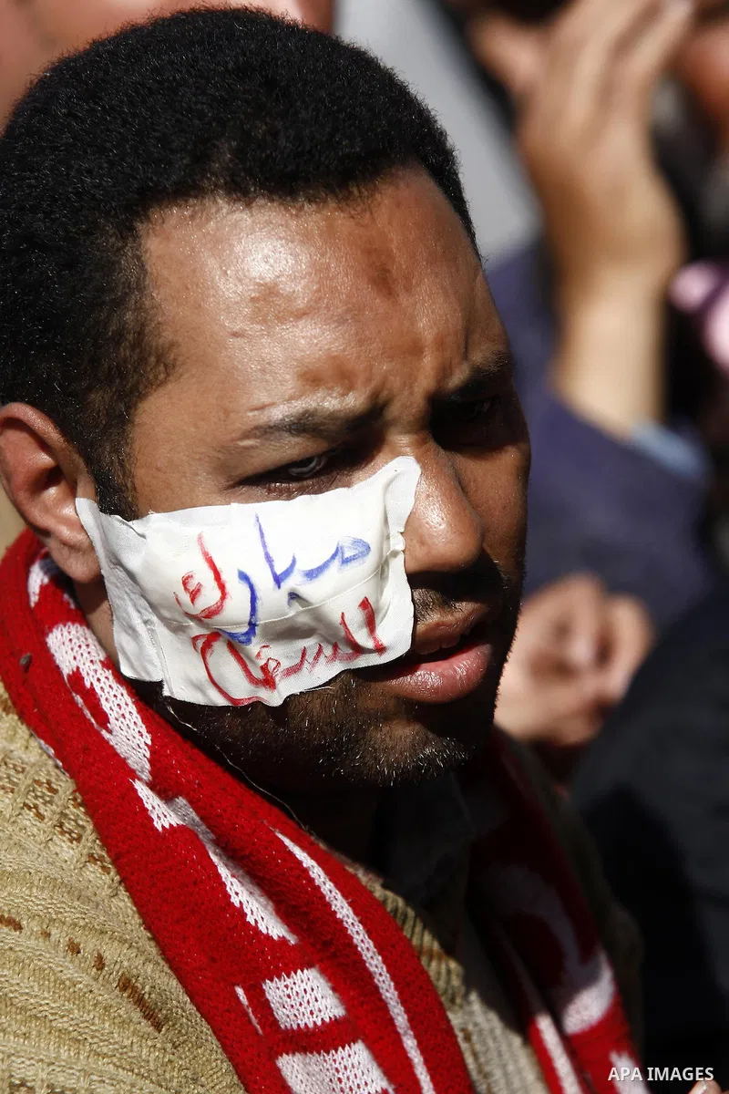 An injured opposition supporter is seen in Tahrir Square in Cairo February 6, 2011. Demonstrators camped out in Cairo's Tahrir Square, which has become an epicentre for protest, vowed to intensify their battle to oust Eg...