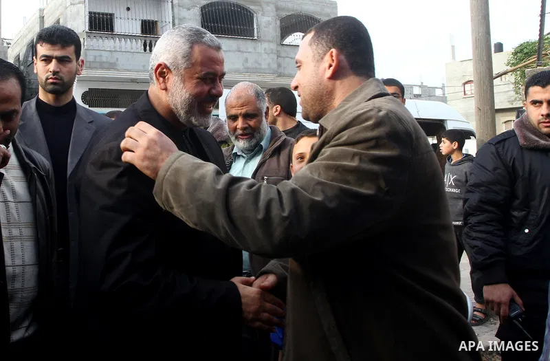 Palestinian Prime Minister in Gaza Strip, Ismail Haneiyah greets the top Hamas armed commander Ayman Nofal upon his arrival to his home in Nusairat refugee camp in the Central Gaza strip, Sunday , Feb. 6, 2011. The Pales...