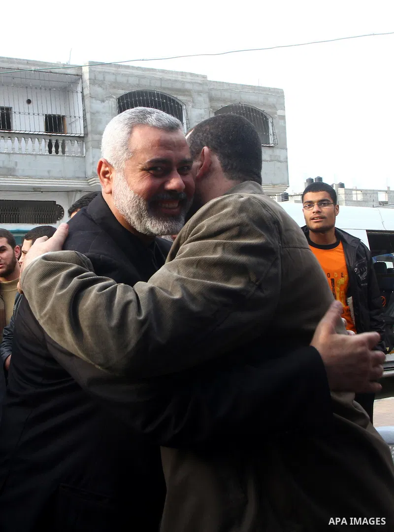 Palestinian Prime Minister in Gaza Strip, Ismail Haneiyah greets the top Hamas armed commander Ayman Nofal upon his arrival to his home in Nusairat refugee camp in the Central Gaza strip, Sunday , Feb. 6, 2011. The Pales...