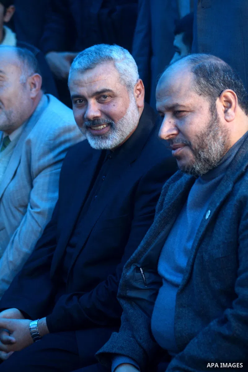 Palestinian Prime Minister in Gaza Strip, Ismail Haneiyah greets the top Hamas armed commander Ayman Nofal upon his arrival to his home in Nusairat refugee camp in the Central Gaza strip, Sunday , Feb. 6, 2011. The Pales...