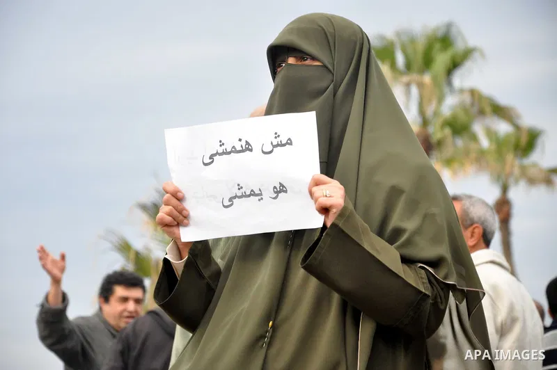 Egyptian protesters take part in a protest called 'Sunday of the martyrs' in Alexandria, Egypt, 06 February 2011. Anti-government protests entered its 13th straight day in Egypt, as solutions were being mulled to bring a...