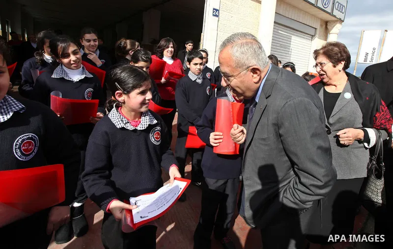 Palestinian Prime Minister Salam Fayyad puts the corner stone for the Evangelical Lutheran School in the West Bank city of Ramallah on Feb. 7,2011. Photo by Mustafa Abu Dayeh