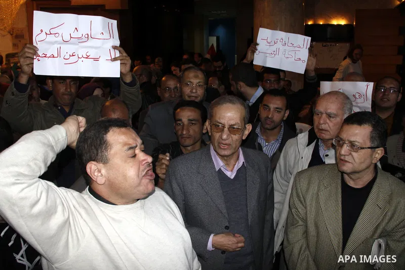 People take part in a symbolic funeral ceremony for the Egyptian journalist, Ahmed Mohammed Mahmoud in Tahrir Square, Cairo, Egypt, Monday, Feb. 7, 2011. The reporter who was shot during clashes a week ago died of his wo...
