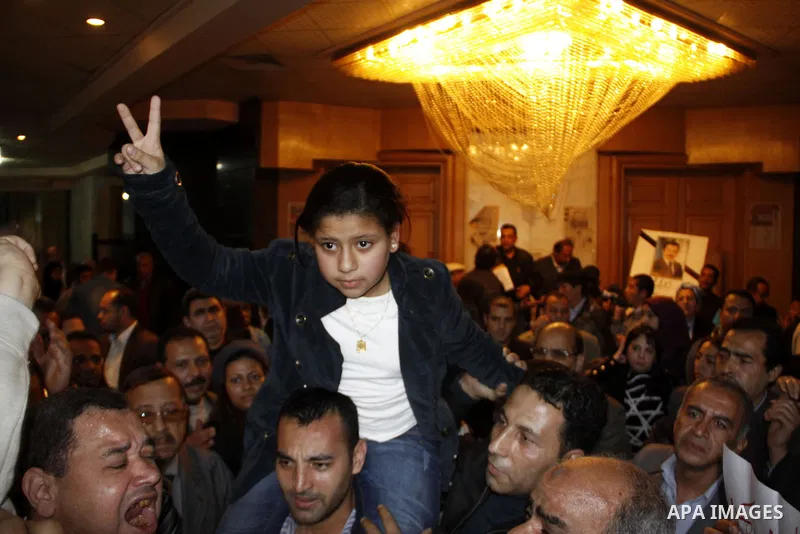 The daughter of the Egyptian journalist, Ahmed Mohammed Mahmoud takes part in a symbolic funeral ceremony for her father in Tahrir Square, Cairo, Egypt, Monday, Feb. 7, 2011. The reporter who was shot during clashes a we...
