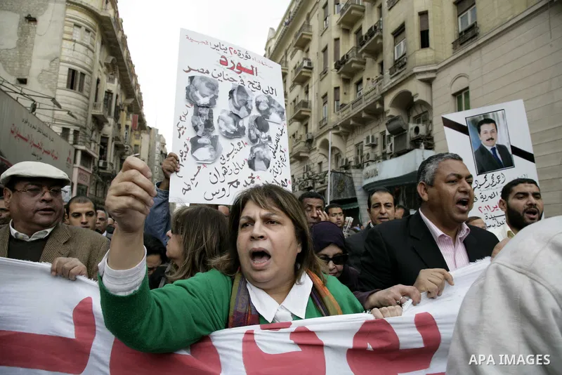 People take part in a symbolic funeral ceremony for the Egyptian journalist, Ahmed Mohammed Mahmoud in Tahrir Square, Cairo, Egypt, Monday, Feb. 7, 2011. The reporter who was shot during clashes a week ago died of his wo...