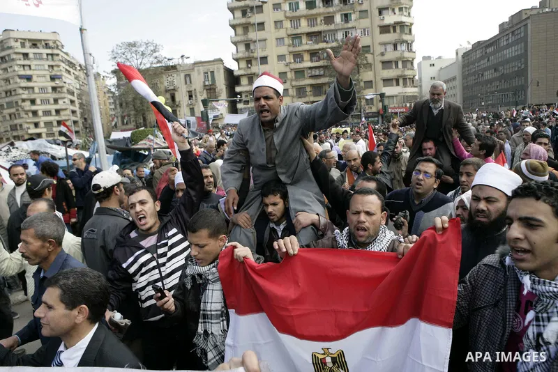 Egyptian anti-government protesters demonstrate in Tahrir Square in Cairo, Egypt, Monday, Feb. 7, 2011. The protests, which saw tens of thousands of people massing daily in downtown Cairo for demonstrations that at times...