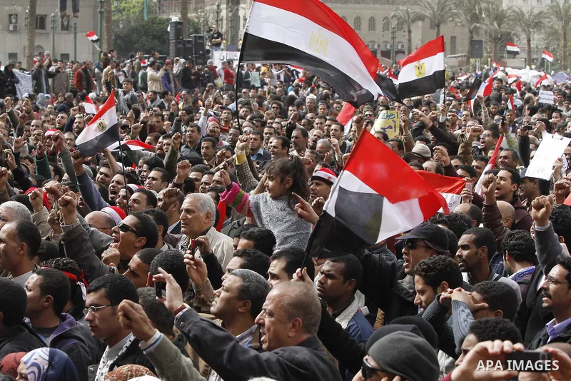 Egyptian anti-government protesters demonstrate in Tahrir Square in Cairo, Egypt, Monday, Feb. 7, 2011. The protests, which saw tens of thousands of people massing daily in downtown Cairo for demonstrations that at times...