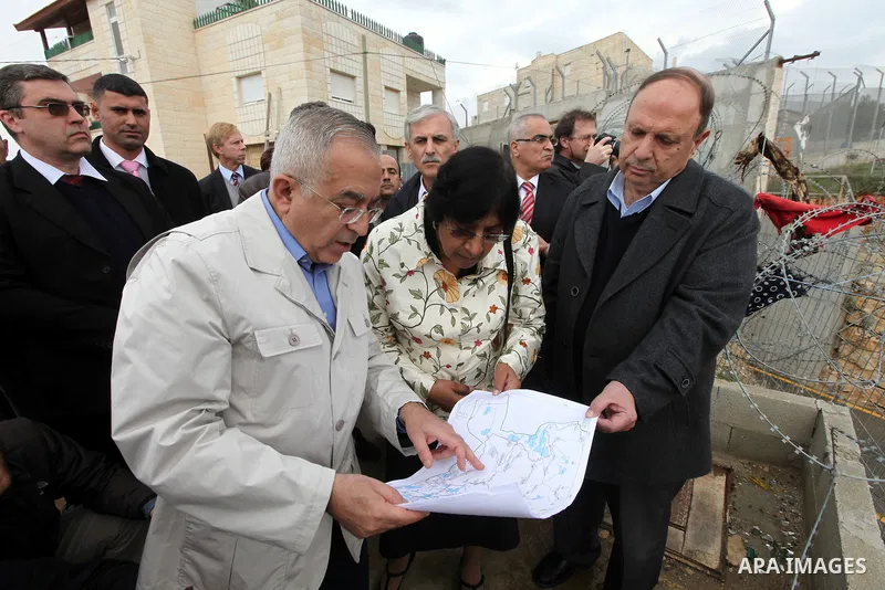 U.N. High Commissioner for Human Rights Navi Pillay and Palestinian prime minister Salam Fayyad visit the Sabri Gareeb Palestinian family home which is situated in the center of the settlement just south of Ramallah in t...
