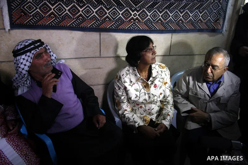 U.N. High Commissioner for Human Rights Navi Pillay and Palestinian prime minister Salam Fayyad visit the Sabri Gareeb Palestinian family home which is situated in the center of the settlement just south of Ramallah in t...
