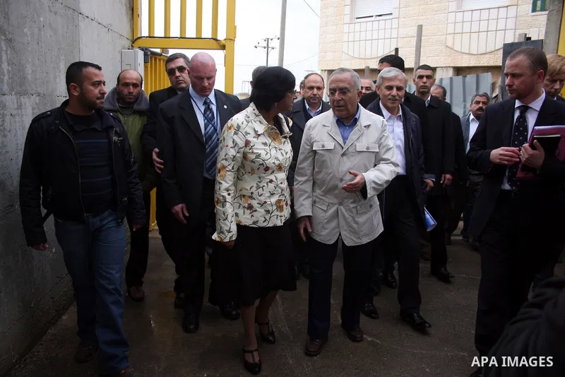 U.N. High Commissioner for Human Rights Navi Pillay and Palestinian prime minister Salam Fayyad visit the Sabri Gareeb Palestinian family home which is situated in the center of the settlement just south of Ramallah in t...