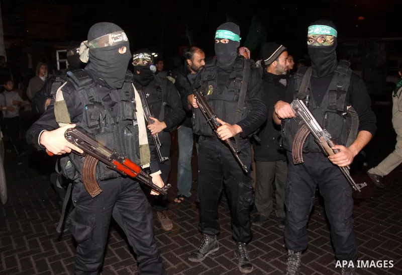 Palestinian Hamas militants take part in a rally in front of the house of the prisoner Ashraf al-Balogei in Gaza City on Feb. 7,2011. Photo by Mohammed Asad