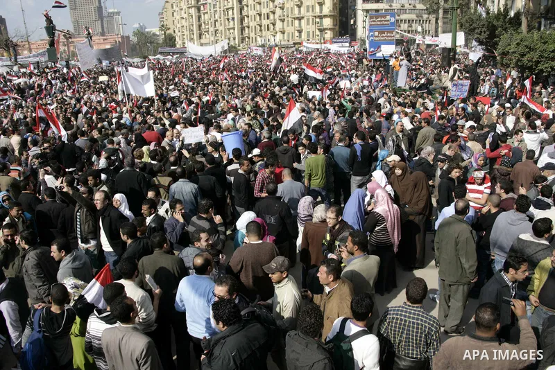 Anti-government protesters take part in demonstrations in Tahrir Square in downtown Cairo, Egypt, Tuesday, Feb. 8, 2011. Protesters appear to have settled in for a long standoff, turning Tahrir Square into a makeshift vi...