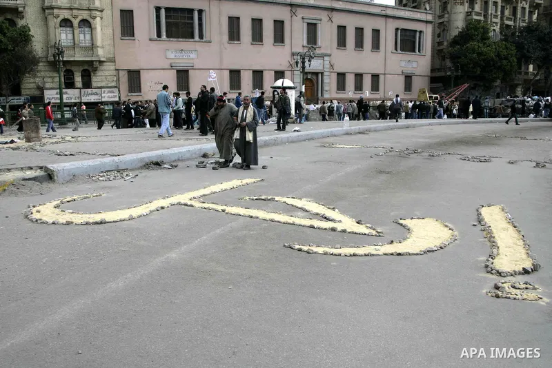 Anti-government protesters take part in demonstrations in Tahrir Square in downtown Cairo, Egypt, Tuesday, Feb. 8, 2011. Protesters appear to have settled in for a long standoff, turning Tahrir Square into a makeshift vi...